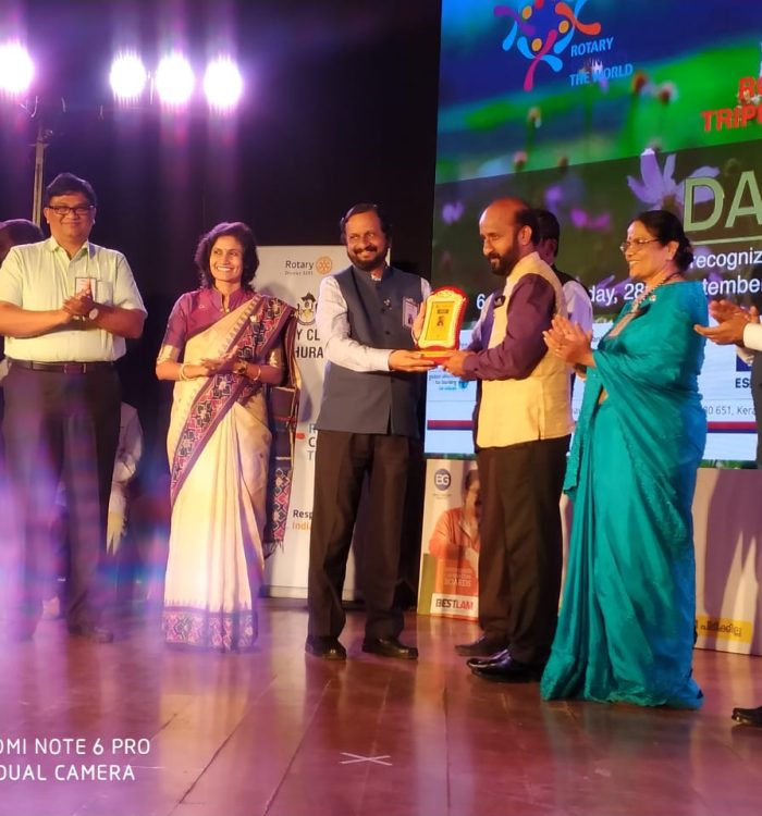 Receiving-the-Humanitarian-Service-Award-from-Rotary